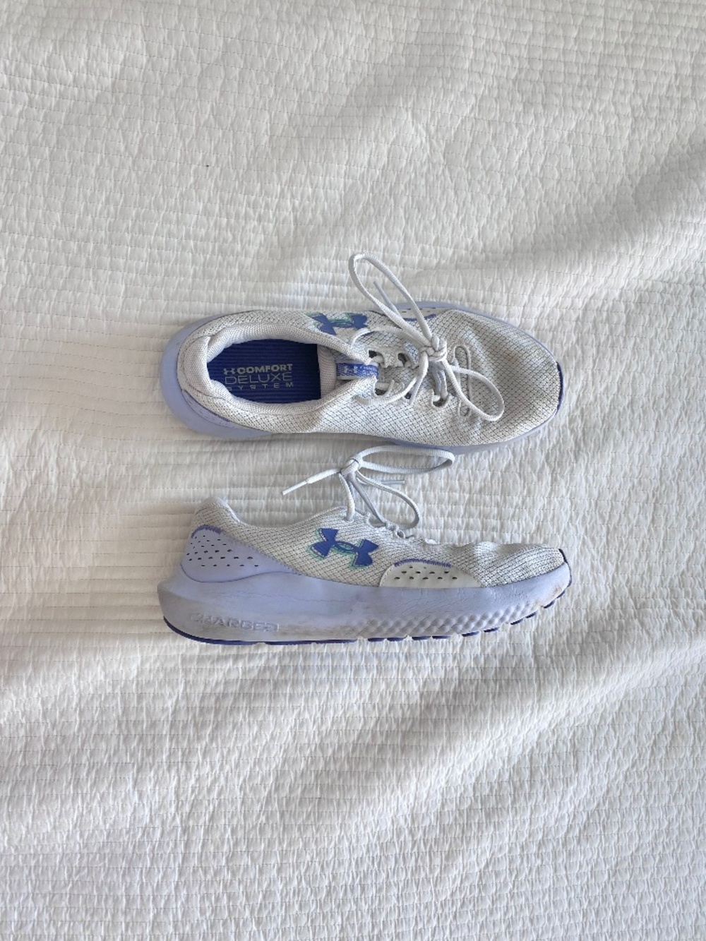 pastel purple and gray under Armour sneakers